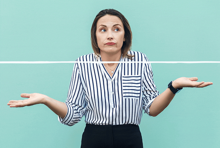a woman in a striped shirt is shrugging her shoulders
