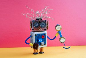 a toy robot is talking on a telephone