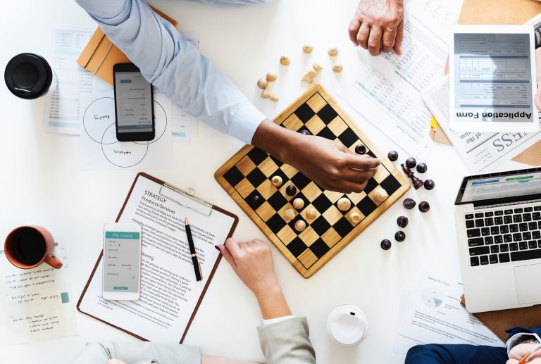 a clipboard with the word strategy on it