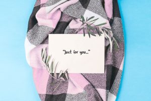 a card that says " just for you " on a plaid blanket