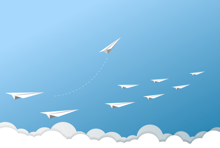 a group of paper airplanes flying in a blue sky