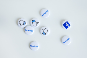 a bunch of Facebook buttons on a white surface