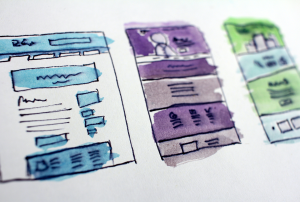 three sketches of a newsletter design