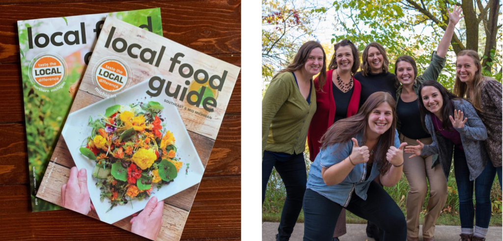 a group of women posing for a photo next to a local food guide