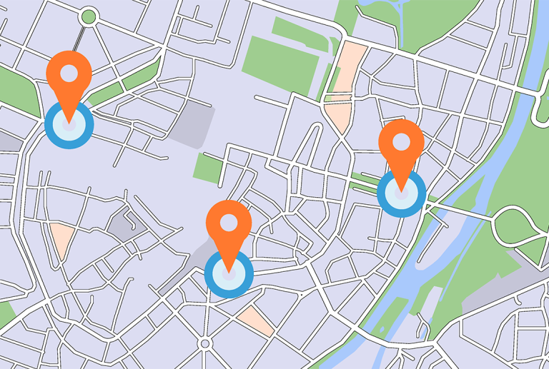 a map of a city with three orange pins on it