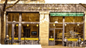 the outside of Caffe Umbria with people sitting outside