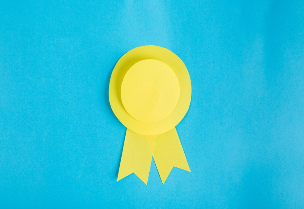 a yellow ribbon is on a blue background