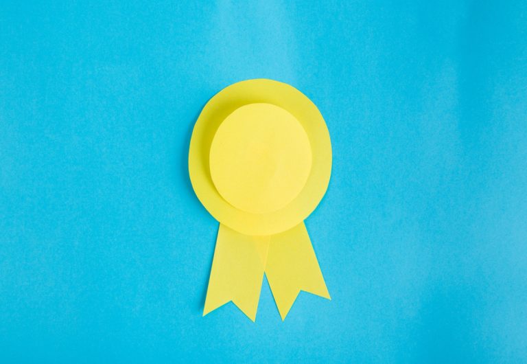 a yellow ribbon is on a blue background
