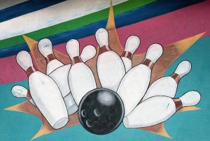 a painting of bowling pins and a bowling ball