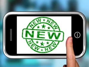 a cell phone with a green stamp that says new
