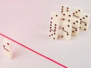 a row of dominoes with a red line between them