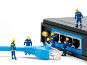 a group of workers are working on an ethernet cable