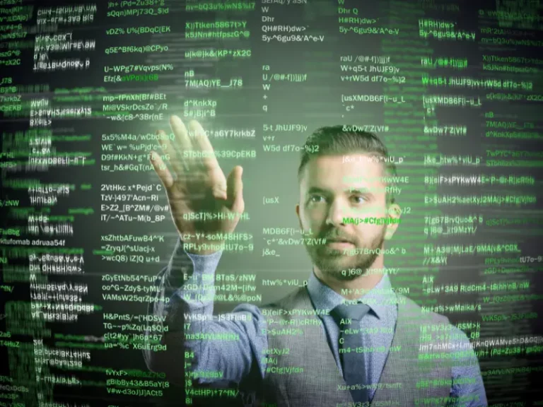 a man is standing in front of a computer screen with lots of green text