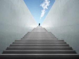 a man stands on top of a set of stairs