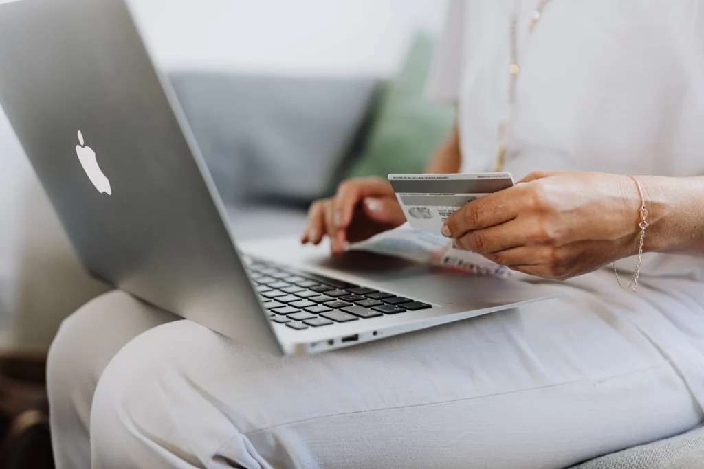 person using laptop for online shopping