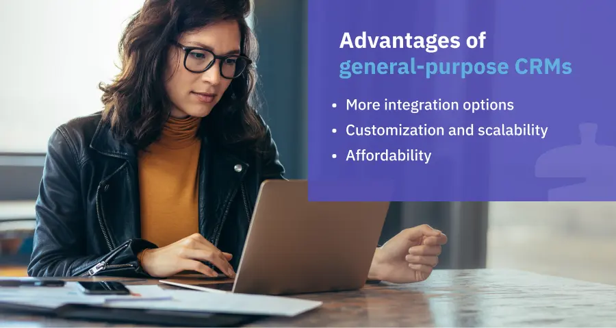 a lady with glasses looking at a laptop with text overlay of the advantages of general-purpose CRMs