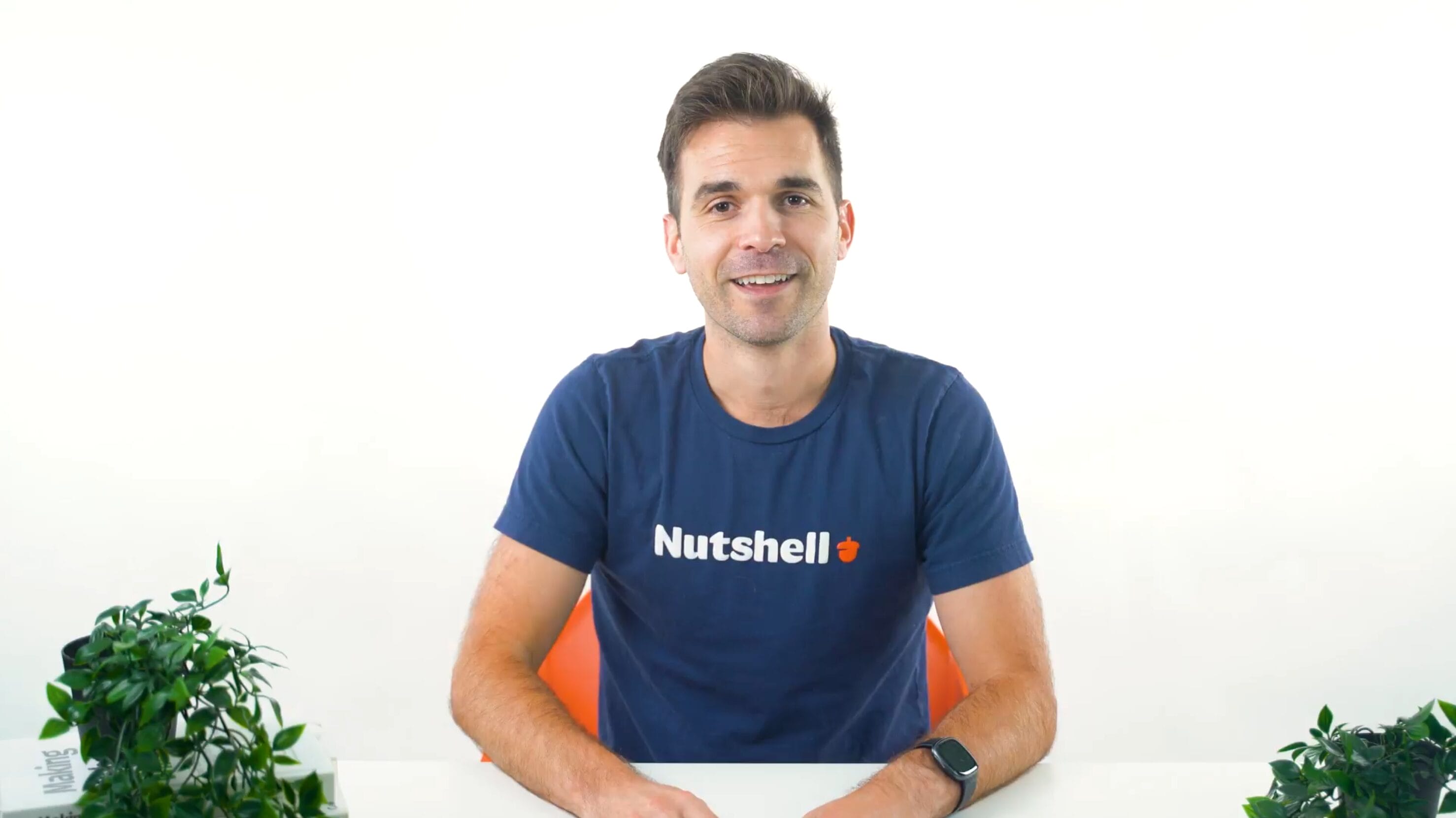 Will in a Nutshell shirt sitting at a desk
