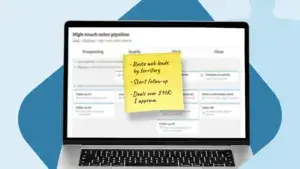 Handwritten list of three sales automation tasks on a sticky note attached to a laptop